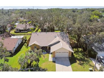 Single Gathering home with a large backyard, situated in a quiet neighborhood at 9142 Brooker Dr, New Port Richey, FL 34655