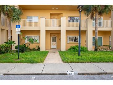 Two-story building with multiple entrances and parking at 2209 Utopian E Dr # 109, Clearwater, FL 33763