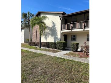 Condo building exterior with landscaping at 5521 Bay Blvd # 101, Port Richey, FL 34668