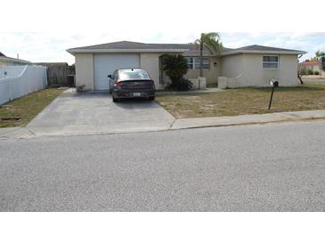 Single-story house with a driveway and garage at 7204 Westcott Dr, Port Richey, FL 34668