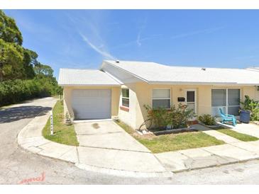 Ranch style home with attached garage and well-manicured lawn at 4913 Hazner St # 4913, New Port Richey, FL 34652