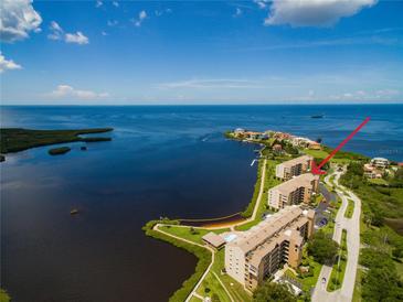 Aerial view showing building location, waterfront access and community amenities at 4620 Bay Blvd # 1148, Port Richey, FL 34668