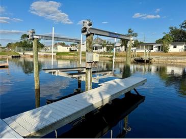 Private boat lift with dock access at 1354 Linstock Dr, Holiday, FL 34690