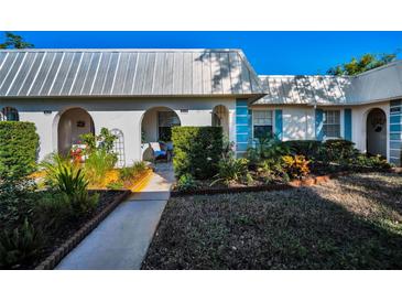 Front view of charming condo with landscaped gardens at 4229 Rax Pl # 4229, New Port Richey, FL 34652