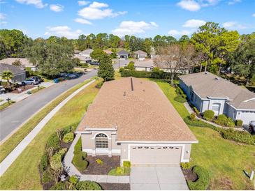 Aerial view of single-Gathering house, showcasing its exterior and landscaping at 4201 Silver Berry Ct, Spring Hill, FL 34609