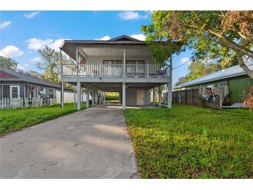 Elevated home with a spacious deck and large backyard at 1244 31St E Ave, Bradenton, FL 34208