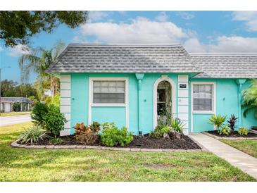 Quaint teal home with well-manicured landscaping at 4209 Prince Pl # A, New Port Richey, FL 34652