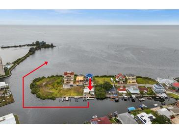 Aerial view of waterfront property with private dock at 6212 Lonnie Lee Ln, Hudson, FL 34667