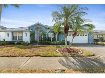 Charming one-story home with a two-car garage and landscaped yard at 8540 Caitlin Ct, Hudson, FL 34667