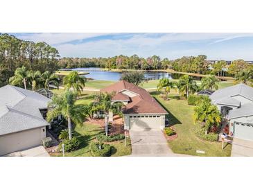 Single-Gathering home with lake and golf course views at 1613 Westerham Loop, Trinity, FL 34655