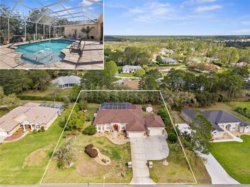 Expansive aerial view of home showcasing screened pool, landscaped yard, and neighborhood at 10124 Southern Breeze Ct, Weeki Wachee, FL 34613