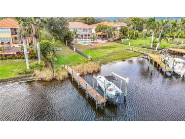 Waterfront home featuring a private boat dock with a boat lift and access to the open water at 4929 N River Shore Dr # A, Tampa, FL 33603