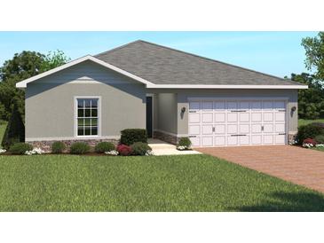 Charming single-story home featuring a two-car garage, neutral paint, and well-manicured landscaping at 625 171St E St, Bradenton, FL 34212