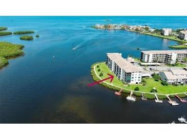 Waterfront condo community with boat docks on a sunny day. Lovely coastal living! at 8150 Brent St # 713, Port Richey, FL 34668