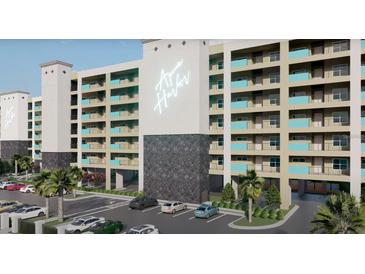 Modern condo building with palm trees and well-maintained parking area and exterior architectural details at 5015 Us Highway 19 # 503, New Port Richey, FL 34652