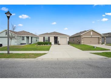 Charming single-story home with well-manicured lawn and inviting curb appeal in a residential neighborhood at 6644 Longboat Dr, Brooksville, FL 34604