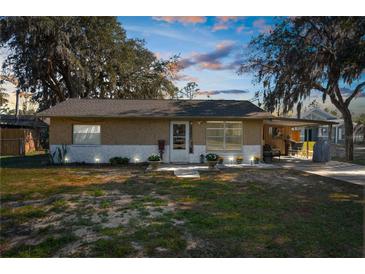 Charming single-story home featuring a cozy front porch and well-maintained landscaping for welcoming curb appeal at 12420 Lacey Dr, New Port Richey, FL 34654