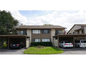 A charming townhome with assigned parking and well-maintained landscaping at 12816 Wedgewood Way # D, Hudson, FL 34667