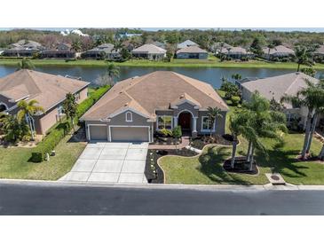 An aerial view of this single Gathering home featuring a private water view at 2330 Tarragon Ln, Trinity, FL 34655