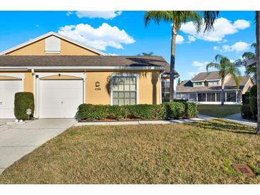 Inviting single-story home with manicured landscaping and attached one car garage at 4208 Boston Cir, New Port Richey, FL 34653