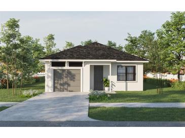 Charming single-story home featuring a well-manicured lawn, a gray garage door, and a concrete driveway at 9024 Waterbird Way, Brooksville, FL 34613