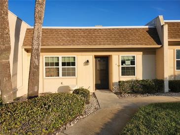 Charming single-story condo with a well-manicured lawn and inviting entrance at 11130 Carriage Hill Dr # 1, Port Richey, FL 34668