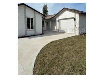Charming single Gathering house with driveway and two car garage at 7336 Ivory Ter, New Port Richey, FL 34655