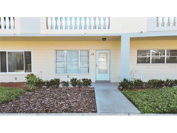Charming condo exterior with well-maintained landscaping and natural light at 2221 Swedish Dr # 15, Clearwater, FL 33763