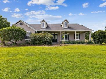Charming single-story home with a well-manicured front lawn and inviting curb appeal at 10318 Piper Dr, New Port Richey, FL 34654