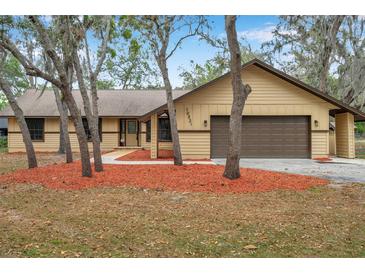 Charming single story home featuring mature trees, cozy front yard and attached two car garage at 10531 Lakeview Dr, New Port Richey, FL 34654