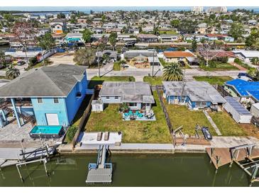 Waterfront home boasts canal access, private dock and easy access to main roads in a charming neighborhood at 13632 Britton Dr, Hudson, FL 34667