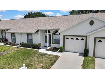 Charming single story home with well-maintained lawn and two-car garage at 4030 Casa Del Sol Way, New Port Richey, FL 34655