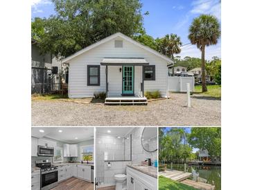 Charming exterior view of home featuring a teal door and neutral color palette at 7252 Coventry Ct, Weeki Wachee, FL 34607
