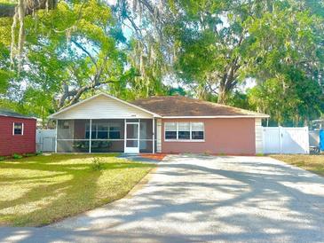 Charming single-story home featuring a spacious yard and mature trees, plus driveway and lawn at 37733 14Th Ave, Zephyrhills, FL 33542