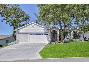 Charming single-Gathering home with a well-manicured lawn, mature trees, and a two-car garage at 2327 Morning Glory Trl, Spring Hill, FL 34606