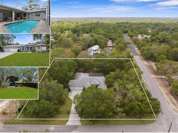 Expansive aerial view of the beautiful property, showcasing the home, lot size and surrounding landscape at 18620 Gracie Lee St, Spring Hill, FL 34610