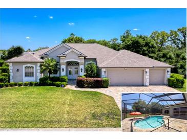 Beautiful single-story home with a three-car garage, lush landscaping, and a screened-in pool area at 3464 Misty View Dr, Spring Hill, FL 34609