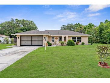 Charming home with a well-manicured lawn and a lovely front yard at 2122 Meadow Lark Rd, Spring Hill, FL 34608