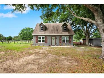 Charming two-story home with a welcoming front yard and lovely curb appeal at 7089 Goodway, Brooksville, FL 34602