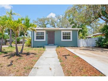 Charming home featuring a well-maintained lawn, a quaint walkway, and inviting curb appeal at 1000 Magnolia Dr, Clearwater, FL 33756