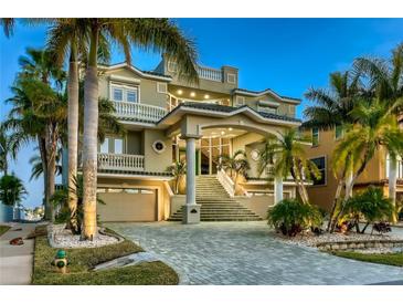 Stunning multi-story home with lush landscaping, grand staircase and three-car garage at 4348 Harborpointe Dr, Port Richey, FL 34668