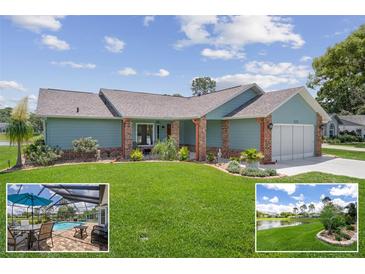 Charming single-story home with a well-manicured lawn and beautiful landscaping at 7175 Bottle Brush Dr, Spring Hill, FL 34606