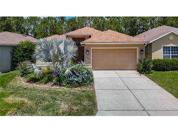 Charming single-Gathering home with well-manicured lawn and a two-car garage at 10181 Holly Berry Dr, Weeki Wachee, FL 34613