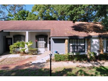 Charming single-story home with neutral paint, rock accents, and meticulous landscaping at 2139 Sea Pines Ct, Spring Hill, FL 34606