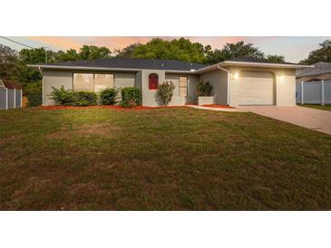 Charming single-story home with well-maintained lawn and a cozy, inviting entrance at 3427 Charmwood Ave, Spring Hill, FL 34609