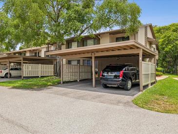 Townhouse with a covered carport, with parking spot and extra storage at 12920 Wedgewood Way # B, Hudson, FL 34667