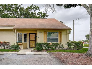 Charming single-story home with guest parking, mature trees and well-maintained landscaping at 10670 43Rd N St # 204, Clearwater, FL 33762
