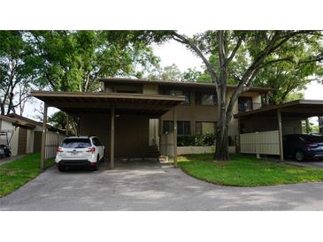 Inviting exterior with carport and well-maintained landscaping, offering curb appeal and convenient parking at 13012 Wedgewood Way # A, Hudson, FL 34667