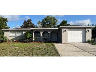 Charming single-story home with a well-maintained lawn and inviting curb appeal at 6108 Maplewood Dr, New Port Richey, FL 34653