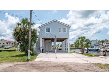 Elevated home with canal access, offering ample parking and outdoor space at 6322 Aureau Ave, Hudson, FL 34667
